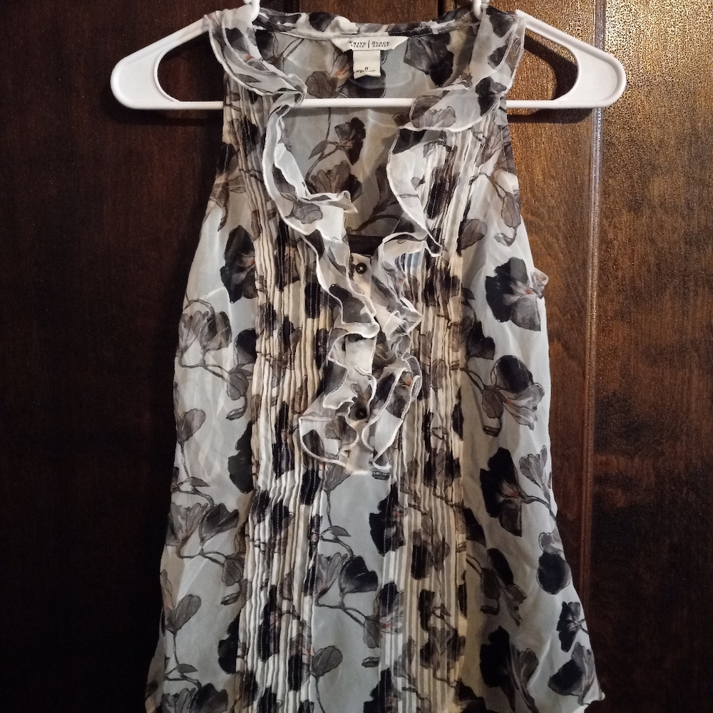White House-Black Market: sleeveless black and white floral ruffles shirt
